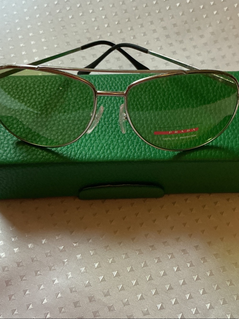 Prada Silver Aviator Sunglasses with Green Lenses